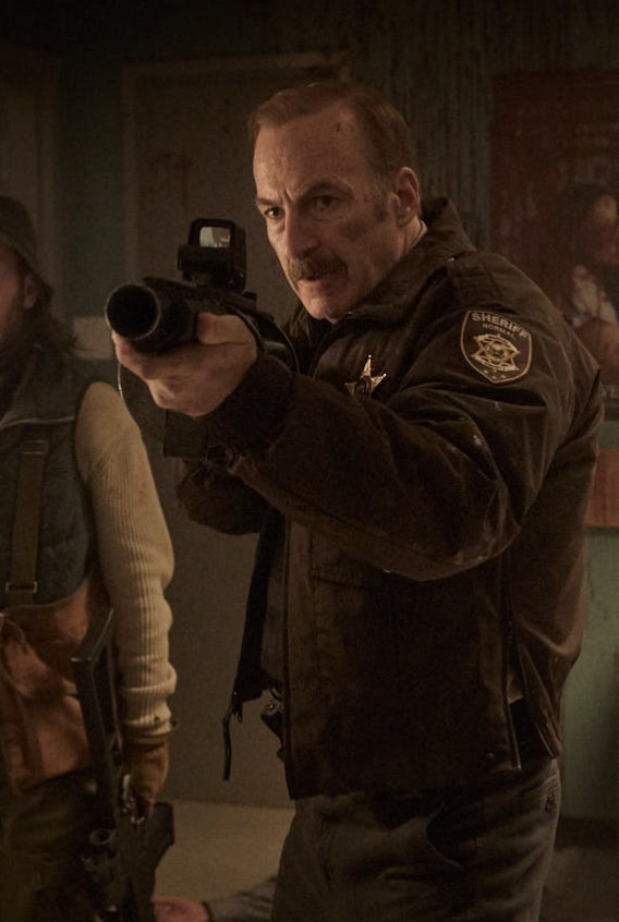 Džono Viko kūrėjai juostai „Šerifui šakės“ turi mįslingą apibūdinimą: neria į naujo žanro paieškas